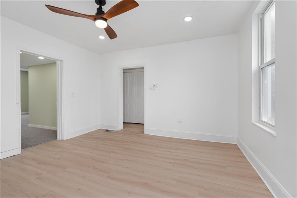 2307 Salisbury Street Pittsburgh, PA 15210 - Photo 14 of 24 wooden floor in an empty room with a window