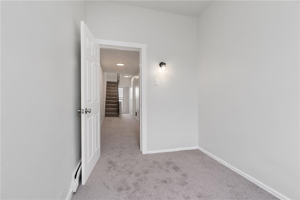 2307 Salisbury Street Pittsburgh, PA 15210 - Photo 20 of 24 a view of a hallway with wooden shelves