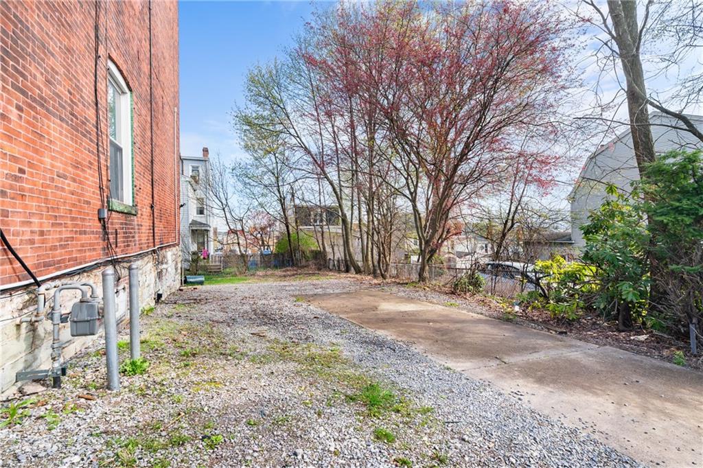 2307 Salisbury Street Pittsburgh, PA 15210 - Photo 21 of 24 a view of a yard with plants and trees