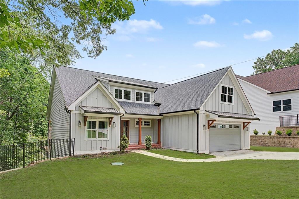 376 Hunnicut Road Southeast Mableton, GA 30126 - Photo 2 of 73 a front view of a house with a garden and yard