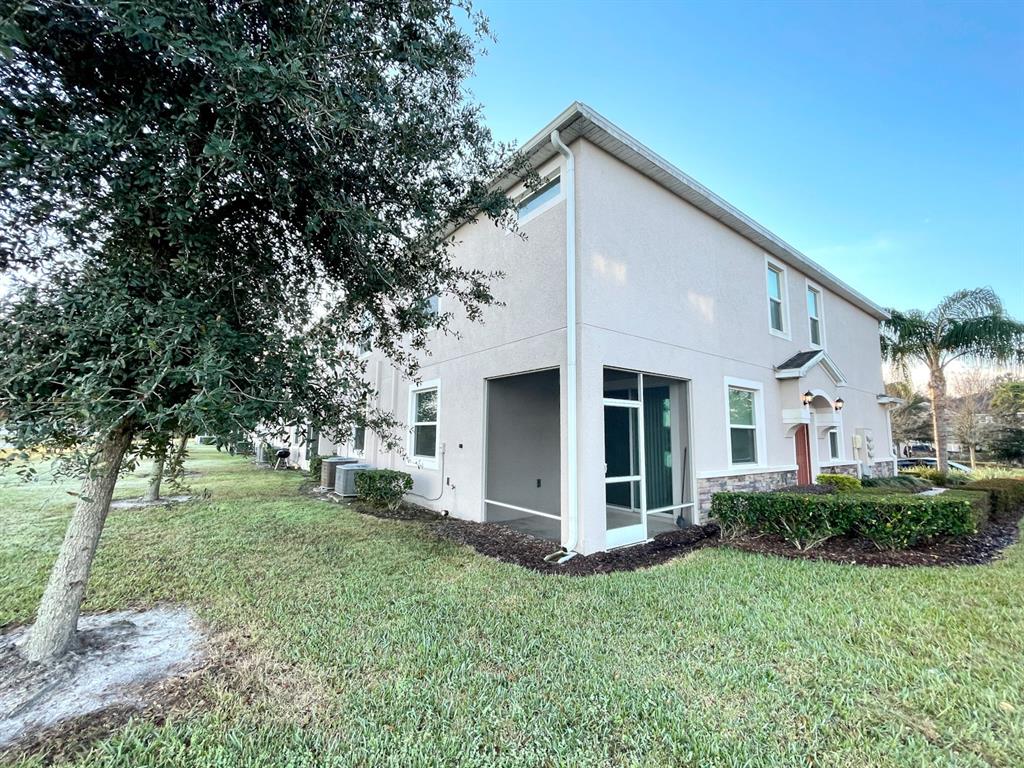 27023 Juniper Bay Drive Wesley Chapel, FL 33544 - Photo 13 of 13 a view of a house with backyard and garden