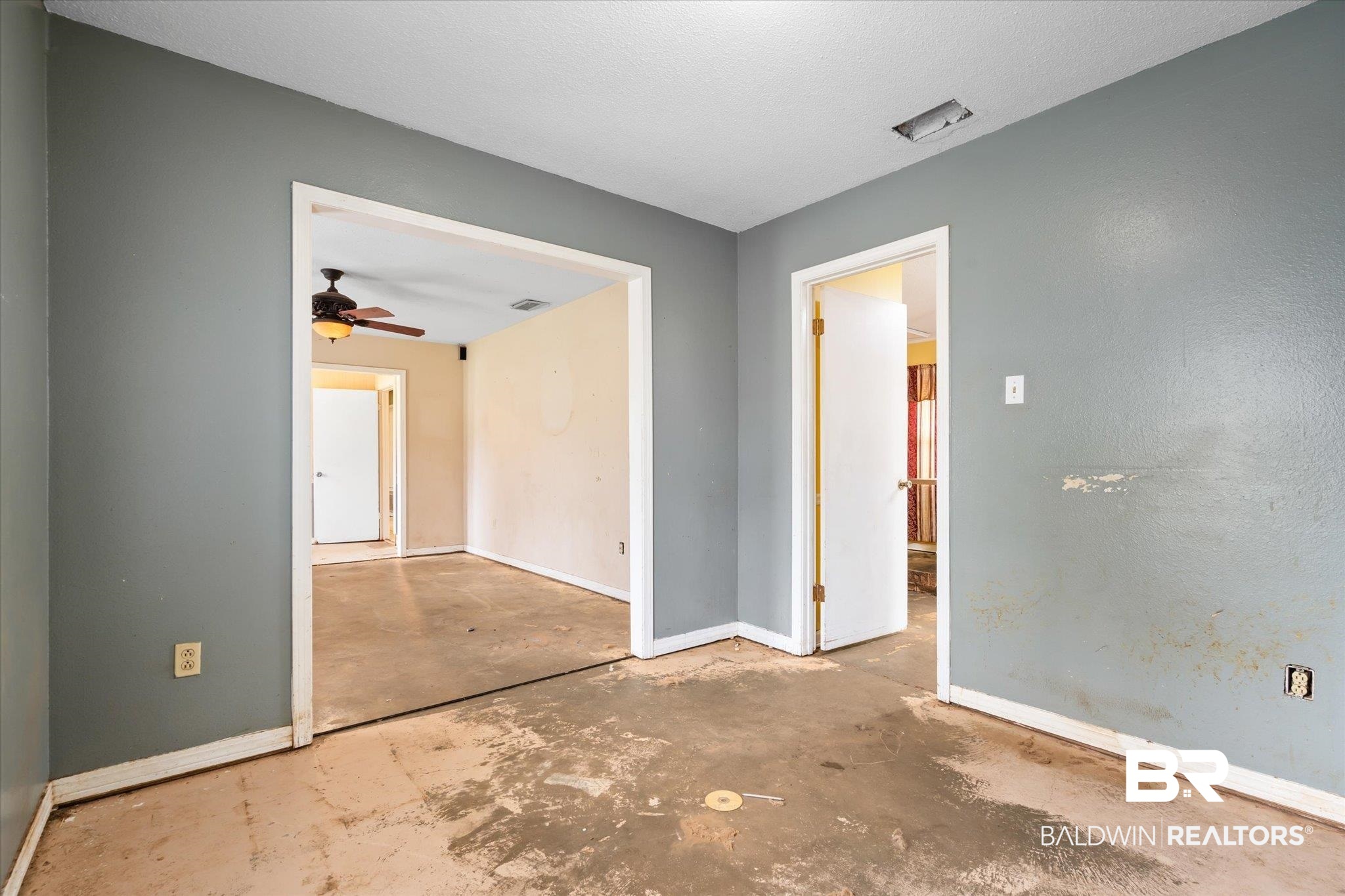 3541 Winston Drive Semmes, AL 36575 - Photo 4 of 20 Spare room with ceiling fan, unfinished concrete floors, and baseboards