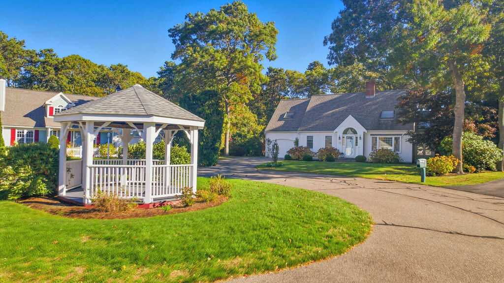 42 Eventide Lane Hyannis, MA 02601 - Photo 27 of 39 a view of house with garden and tall trees