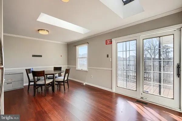 an empty room with wooden floor and closet