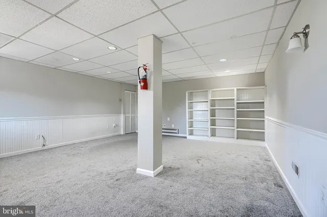 a view of a balcony with wooden floor and fence