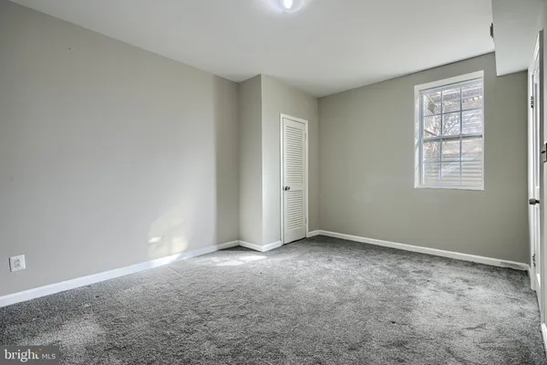 a balcony with wooden floor and furniture