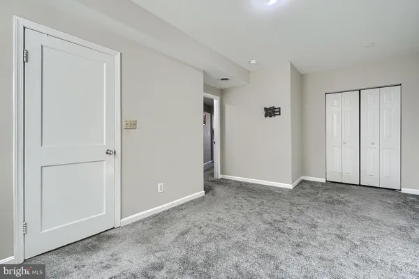 a view of a brick house with many windows