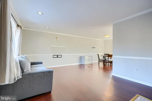 a view of a livingroom with furniture and wooden floor