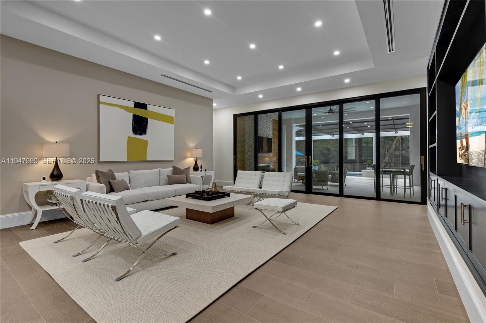 44 Card Sound Road Key Largo, FL 33037 - Photo 11 of 18 a living room with furniture and a large window
