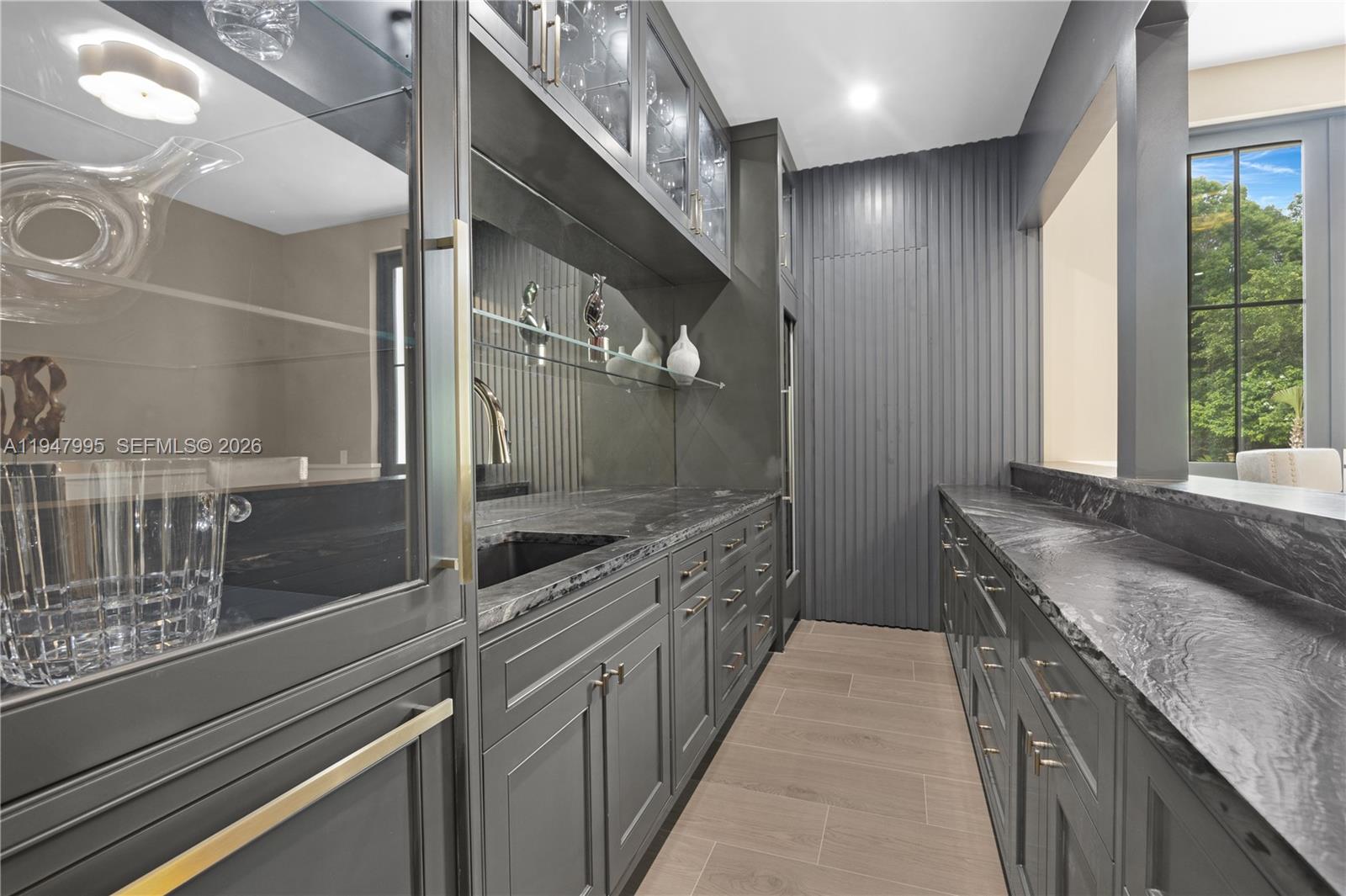 44 Card Sound Road Key Largo, FL 33037 - Photo 14 of 18 a large kitchen with granite countertop a sink and cabinets