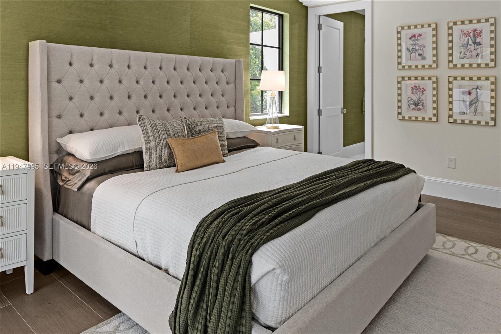 44 Card Sound Road Key Largo, FL 33037 - Photo 15 of 18 a bedroom with bed and wooden floor