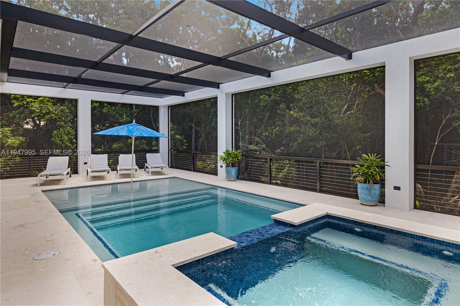 44 Card Sound Road Key Largo, FL 33037 - Photo 18 of 18 a view of a swimming pool with a patio
