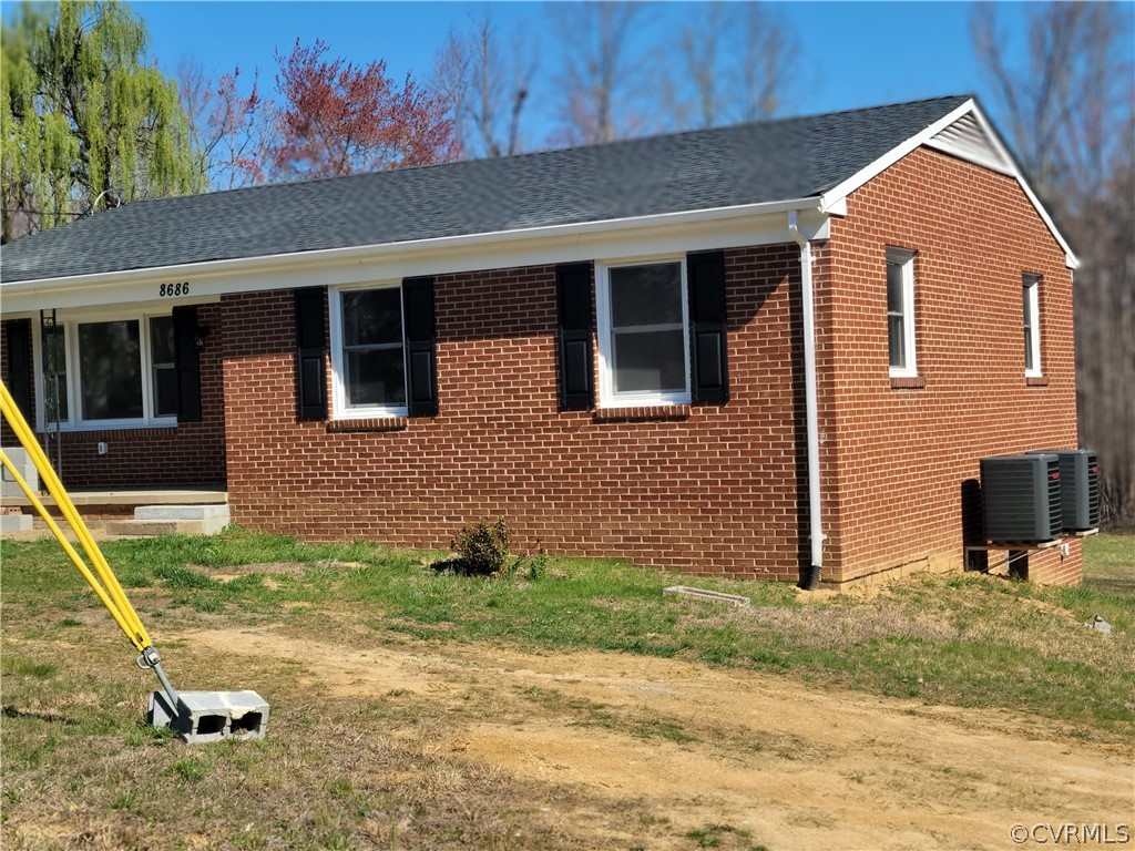 8686 3 Notch Road Louisa, VA 23093 - Photo 1 of 18 a view of a house with backyard and a tree