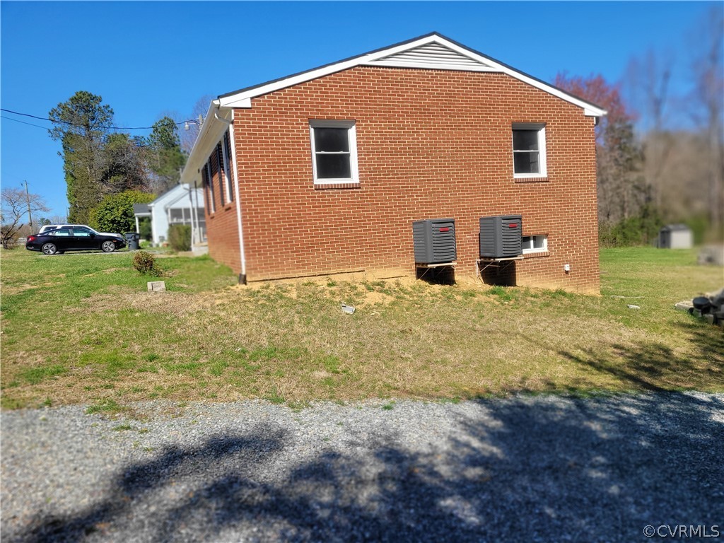 8686 3 Notch Road Louisa, VA 23093 - Photo 3 of 18 a front view of a house with garden