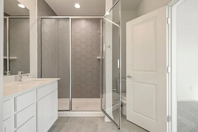 a bathroom with a shower and a sink