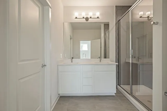 a bathroom with a sink and mirror