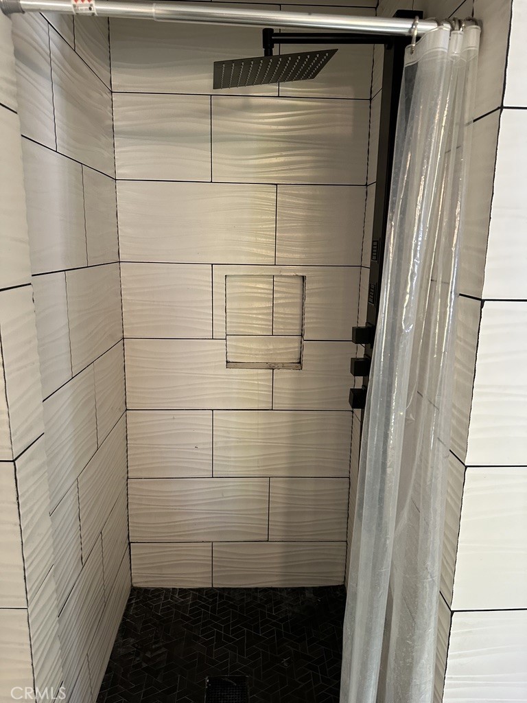 7428 Acoma Trail, Unit 2 Yucca Valley, CA 92284 - Photo 15 of 15 a bathroom with a shower