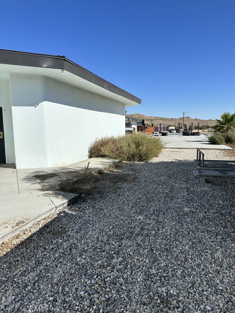 7428 Acoma Trail, Unit 2 Yucca Valley, CA 92284 - Photo 10 of 15 a view of a backyard