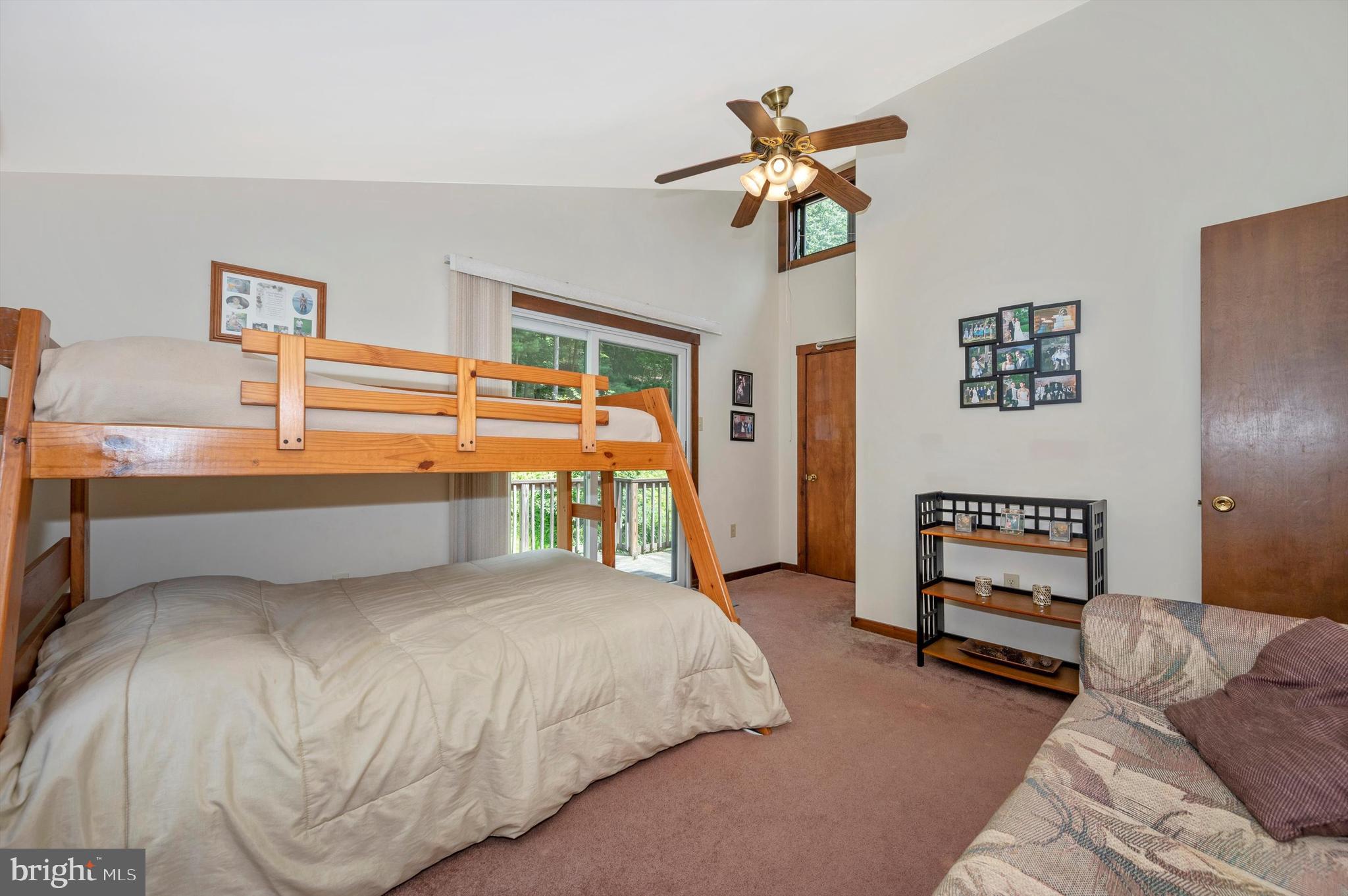 9301 Hamburg Road Frederick, MD 21702 - Photo 32 of 57 a bedroom with a bed and a chandelier