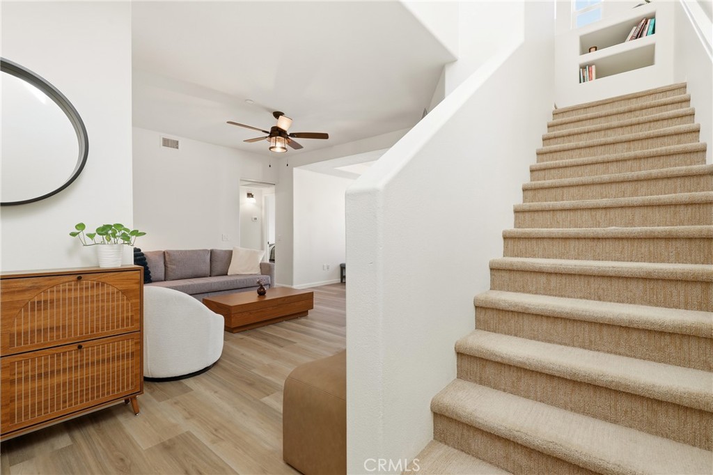 52 Valmont Way Ladera Ranch, CA 92694 - Photo 10 of 29 a living room with furniture and a chandelier