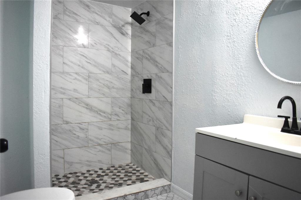 1954 Boat Club Road Oviedo, FL 32765 - Photo 12 of 20 a bathroom with a sink a toilet and shower