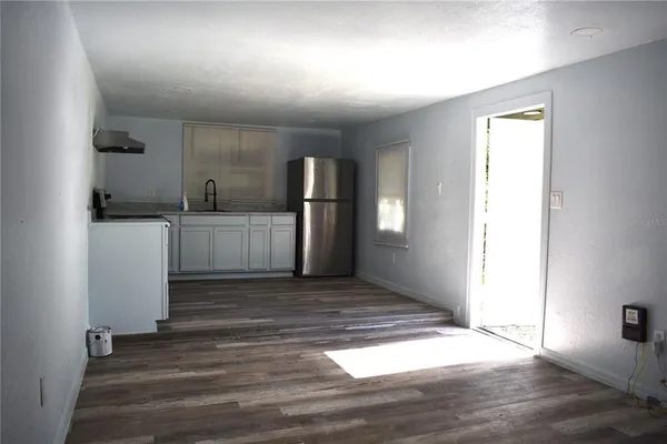 a kitchen with a sink and cabinets
