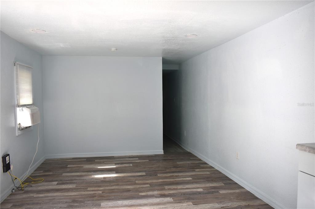 1954 Boat Club Road Oviedo, FL 32765 - Photo 10 of 20 a view of an empty room with wooden floor and a window