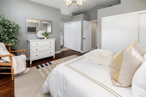 a bedroom with a bed and a dresser