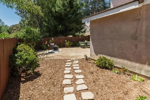 a view of a pathway with a yard