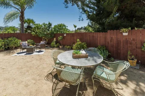 a view of a table and chairs in the patio