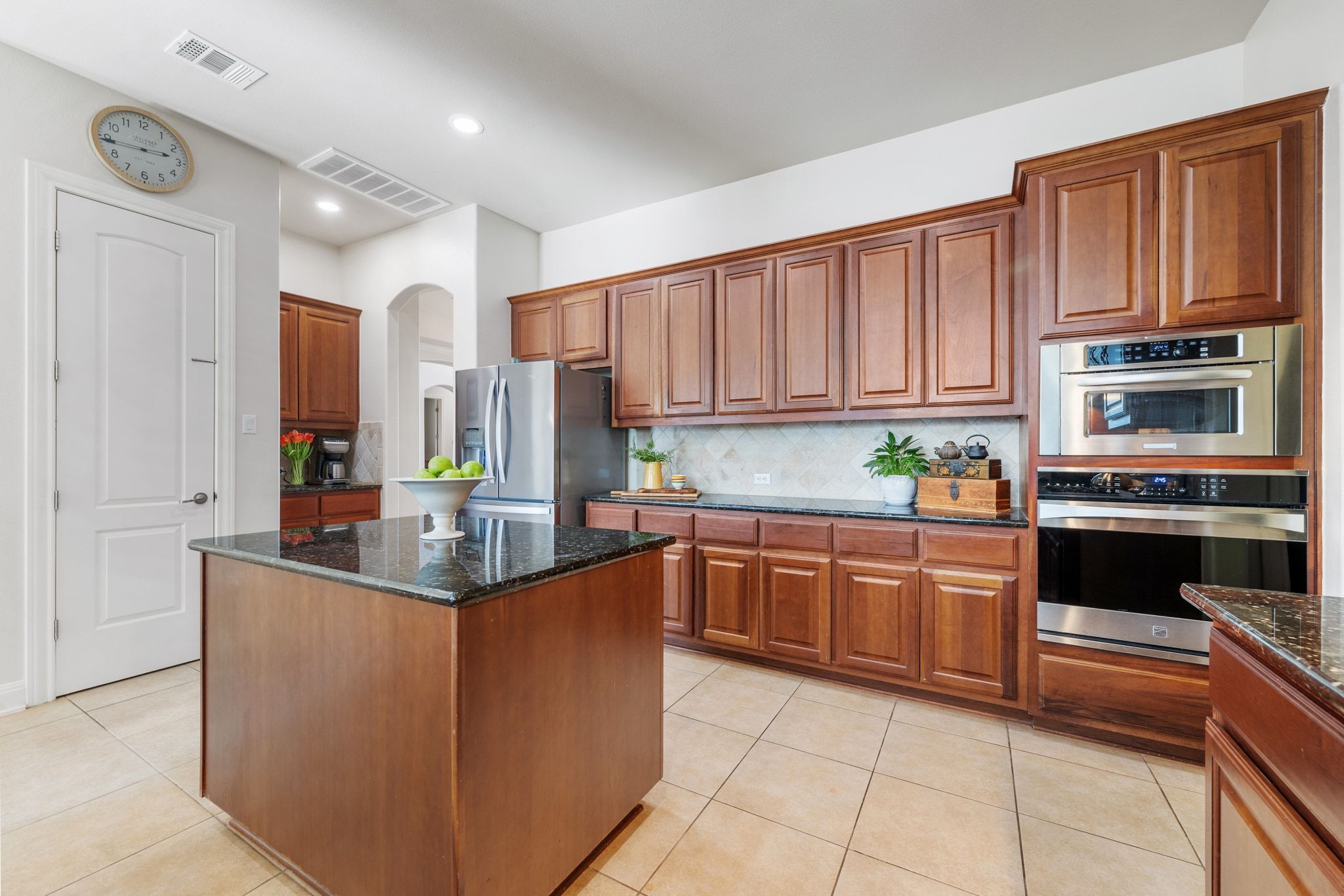 15201 Bat Hawk Circle Austin, TX 78738 - Photo 11 of 33 a kitchen with stainless steel appliances granite countertop a stove and a sink