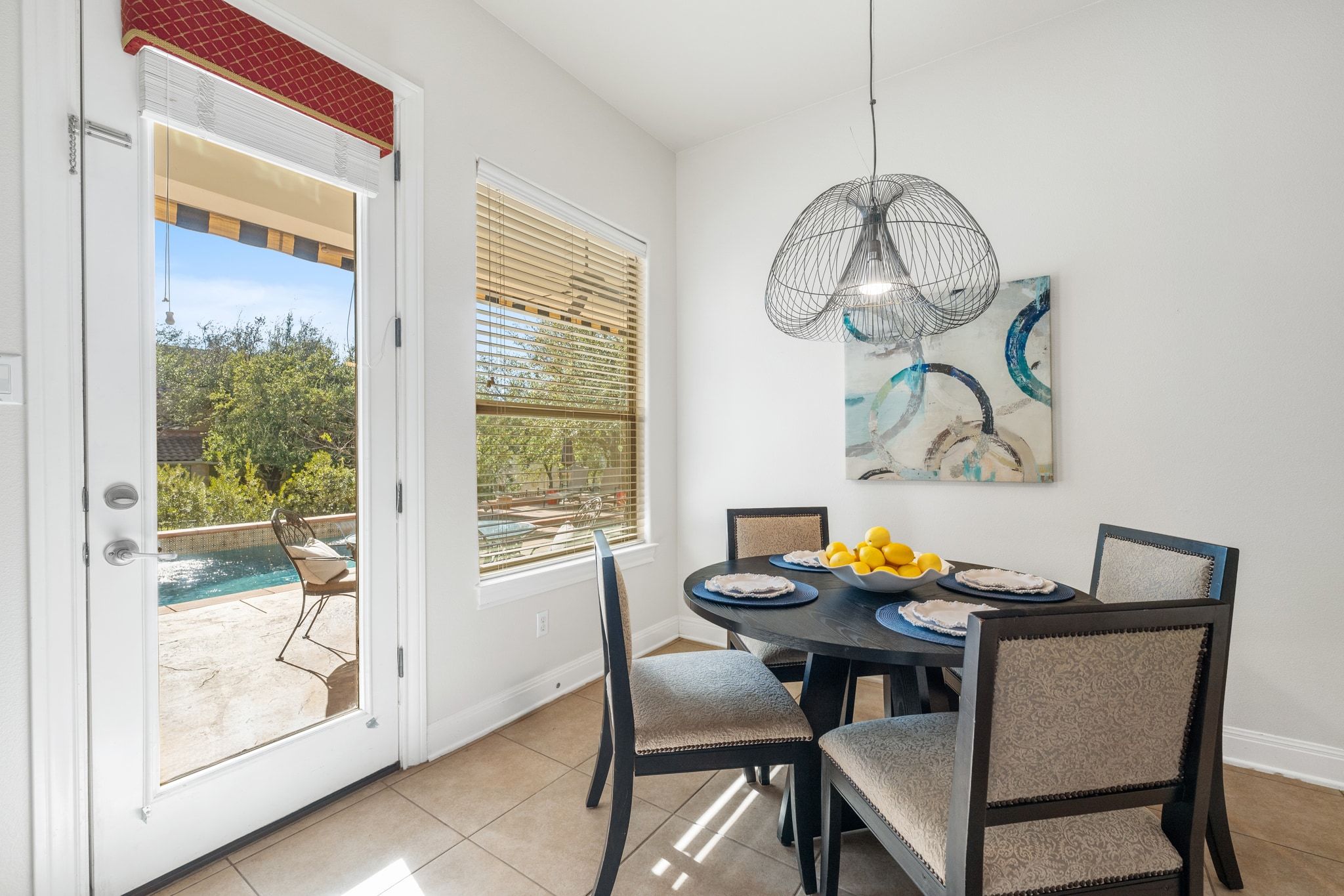 15201 Bat Hawk Circle Austin, TX 78738 - Photo 12 of 33 a view of a dining room with furniture window and outside view