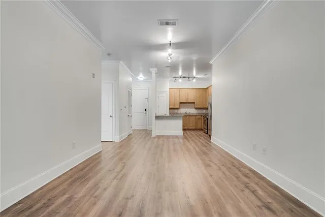 a view of a kitchen with wooden floor