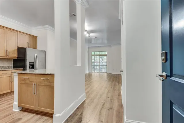 a view of a kitchen with a sink cabinet and a living room
