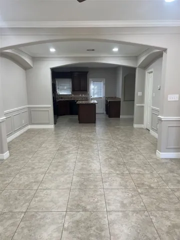 a kitchen with stainless steel appliances granite countertop a stove a sink a microwave a refrigerator and cabinets