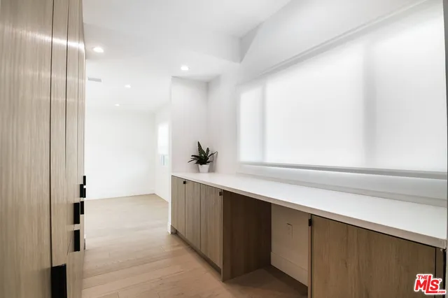 a kitchen with a refrigerator and a sink