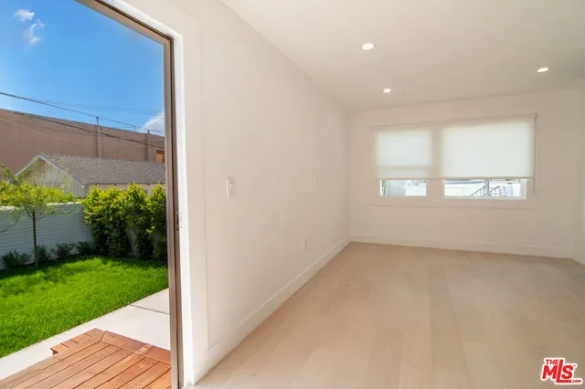 an empty room with closet area