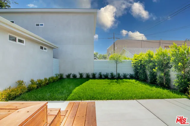 a view of a back yard of the house