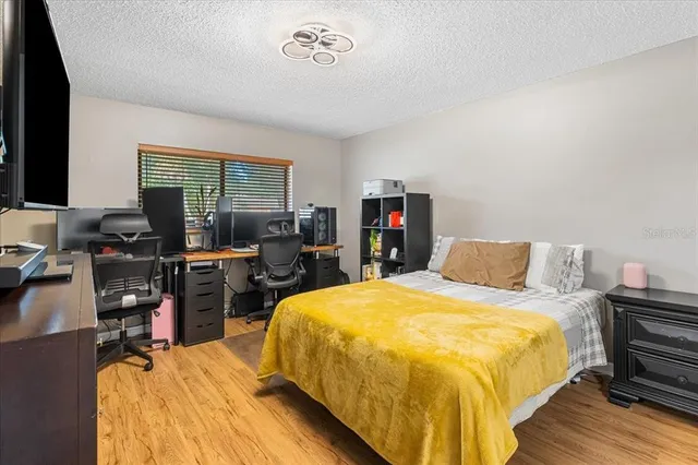 a bedroom with a bed and furniture