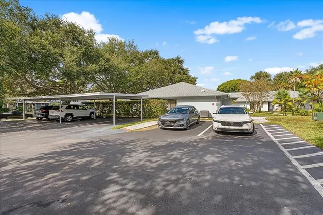 an aerial view of a house with swimming pool and garden space