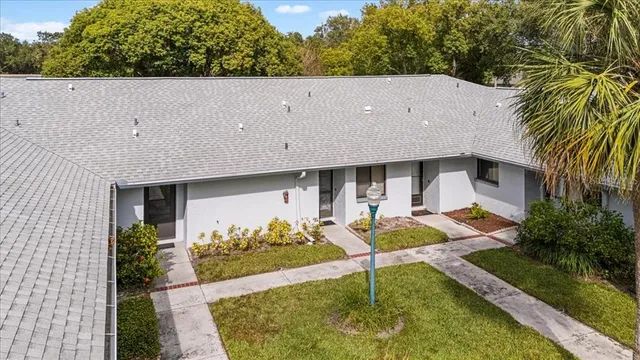 an aerial view of a house with swimming pool