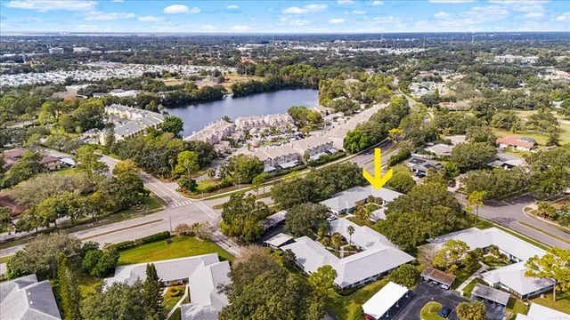 an aerial view of residential building with yard