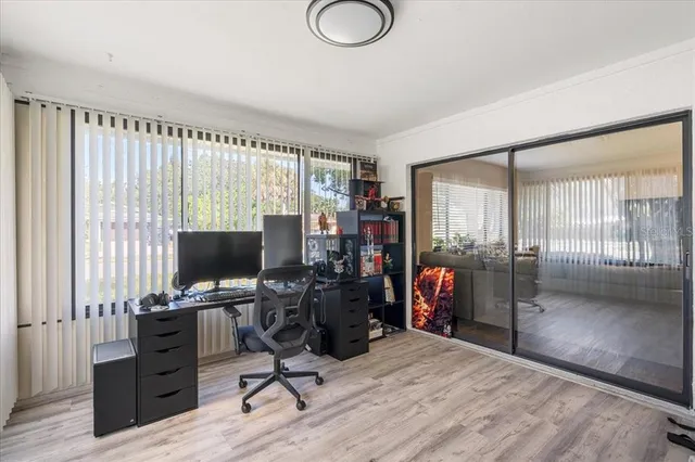 a view of a dining room with furniture and a wooden floor