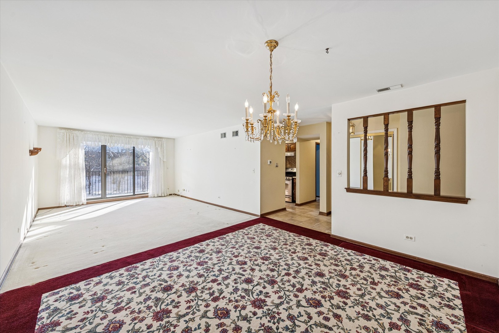 1-s150 Spring Road, Unit 2I Oak Brook, IL 60181 - Photo 12 of 16 a view of a hallway to a bedroom with windows