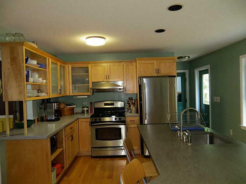 15 Silver Ridge Road Bangor, ME 04401 - Photo 15 of 32 Kitchen. The wood cabinets provide...