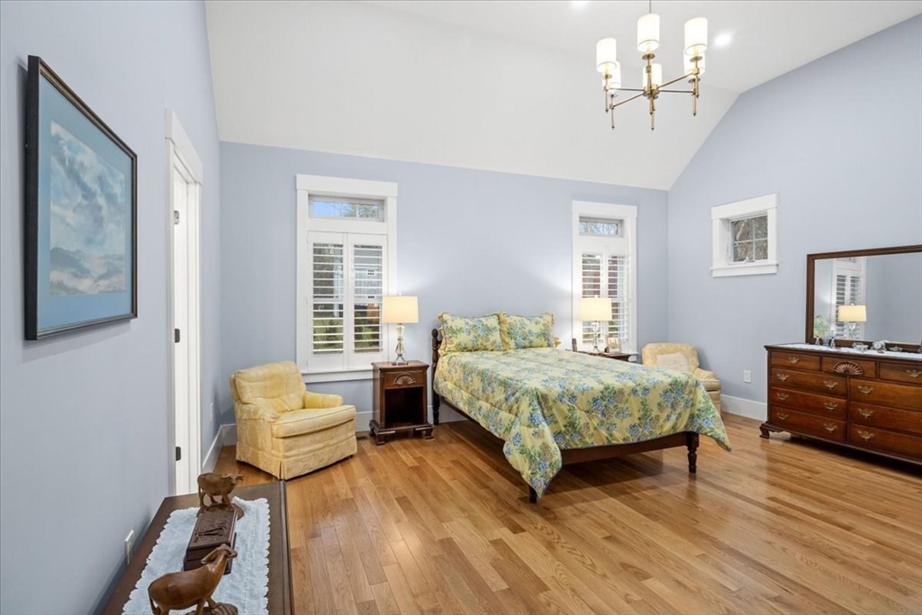 36 Ralyn Road Barnstable, MA 02635 - Photo 11 of 39 a spacious bedroom with a bed and a dresser with wooden floor