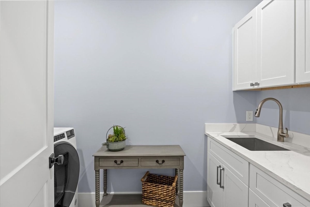 36 Ralyn Road Barnstable, MA 02635 - Photo 12 of 39 a utility room with sink dryer and washer