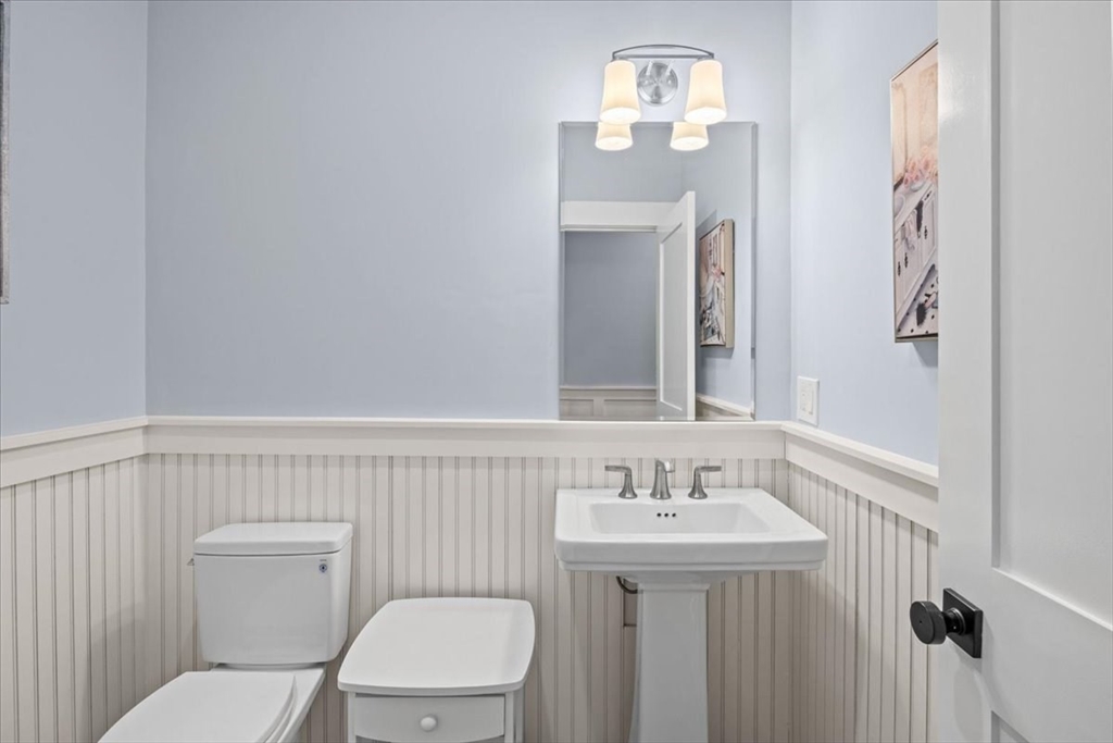 36 Ralyn Road Barnstable, MA 02635 - Photo 13 of 39 a bathroom with a toilet a sink and mirror