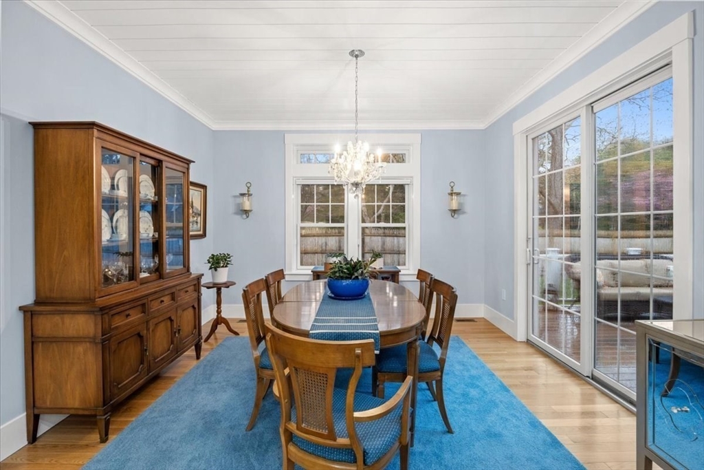 36 Ralyn Road Barnstable, MA 02635 - Photo 15 of 39 a dining room with furniture a chandelier and wooden floor