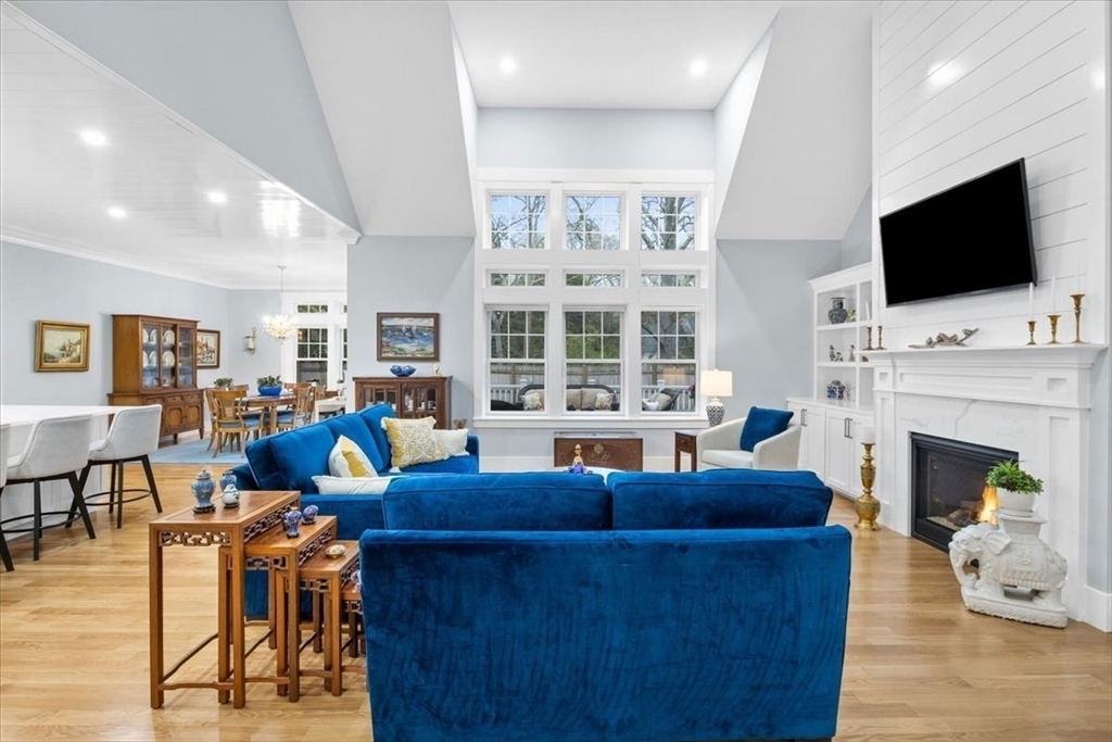 36 Ralyn Road Barnstable, MA 02635 - Photo 17 of 39 a living room with fireplace furniture and a flat screen tv